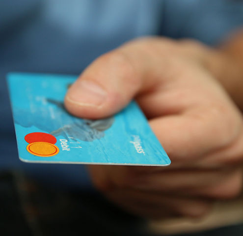 a person holding a credit card